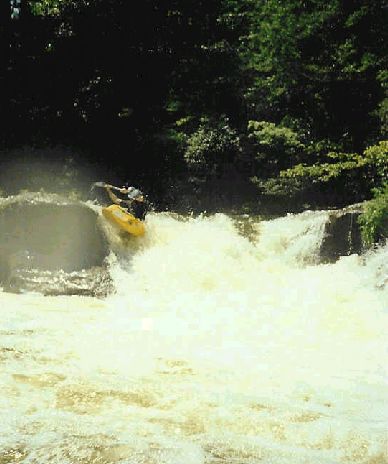 Boyd goin� for the right side boof on the middle line on Old Mill Falls
(photo courtesy Boyd Ruppelt)