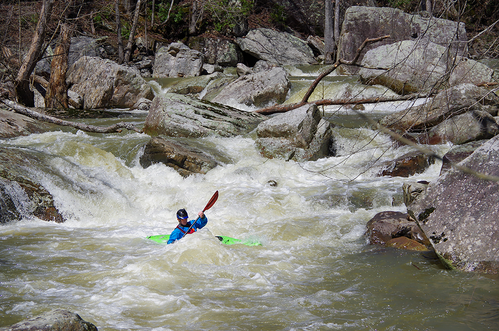 Riley Carroll finishing the triple drop and heading for the must-catch eddy above the sieve rapid.
