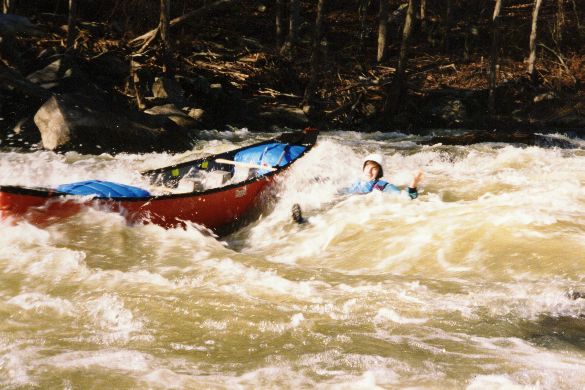 Jeff Bowen says "what the heck" as he rides out the first drop of Double Trouble next to, rather than in, his boat. December 1993.