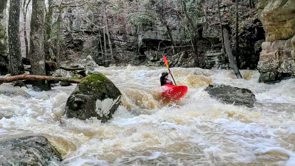 Ben hitting the boof on the second rapid. (Henry DeWald, March 2022)