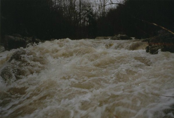 Terminator at high water on February 23, 1991. If you look closely, you will see Mark Cumnock's kayak paddle blade at the crux hole. (Photo courtesy Mark Cumnock)